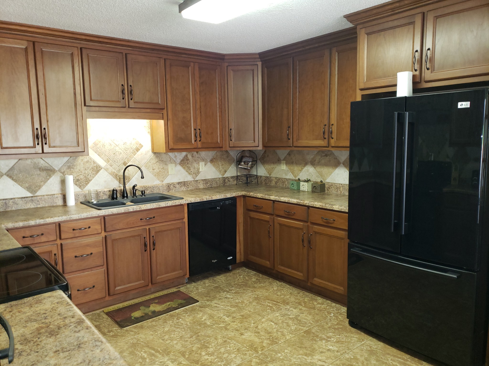 55 Short Creek Road Dellrose, TN 38453 - Photo 8 of 34 a kitchen with a refrigerator sink and cabinets