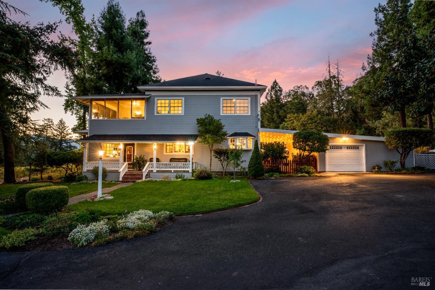 5700 Old River Road Ukiah, CA 95482 - Photo 13 of 56 a front view of a house with a yard and garage