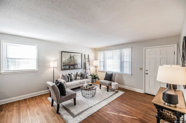 a kitchen that has a sink cabinets counter space and a window