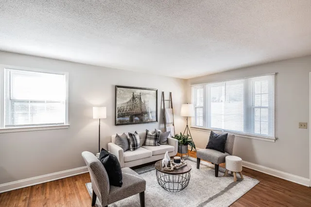 a kitchen with granite countertop wooden cabinets and a sink