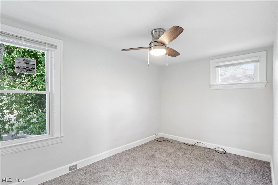 1469 South Noble Road Cleveland, OH 44121 - Photo 16 of 29 Carpeted empty room featuring baseboards