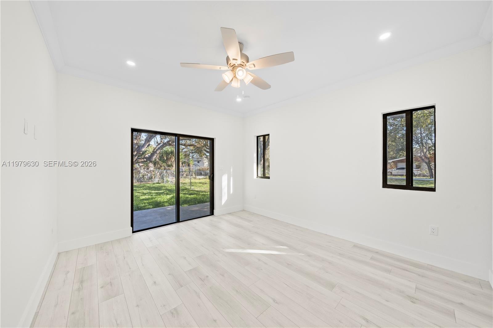 1735 Northwest 84th Street Miami, FL 33147 - Photo 14 of 26 a view of an empty room with a window