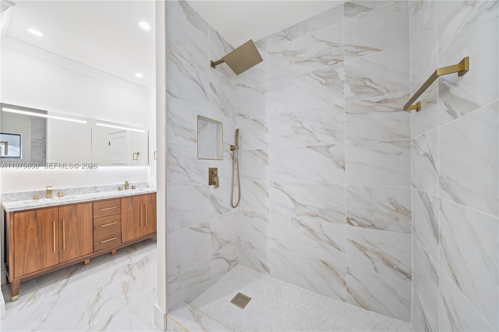 1735 Northwest 84th Street Miami, FL 33147 - Photo 18 of 26 a bathroom with a granite countertop sink a toilet and shower