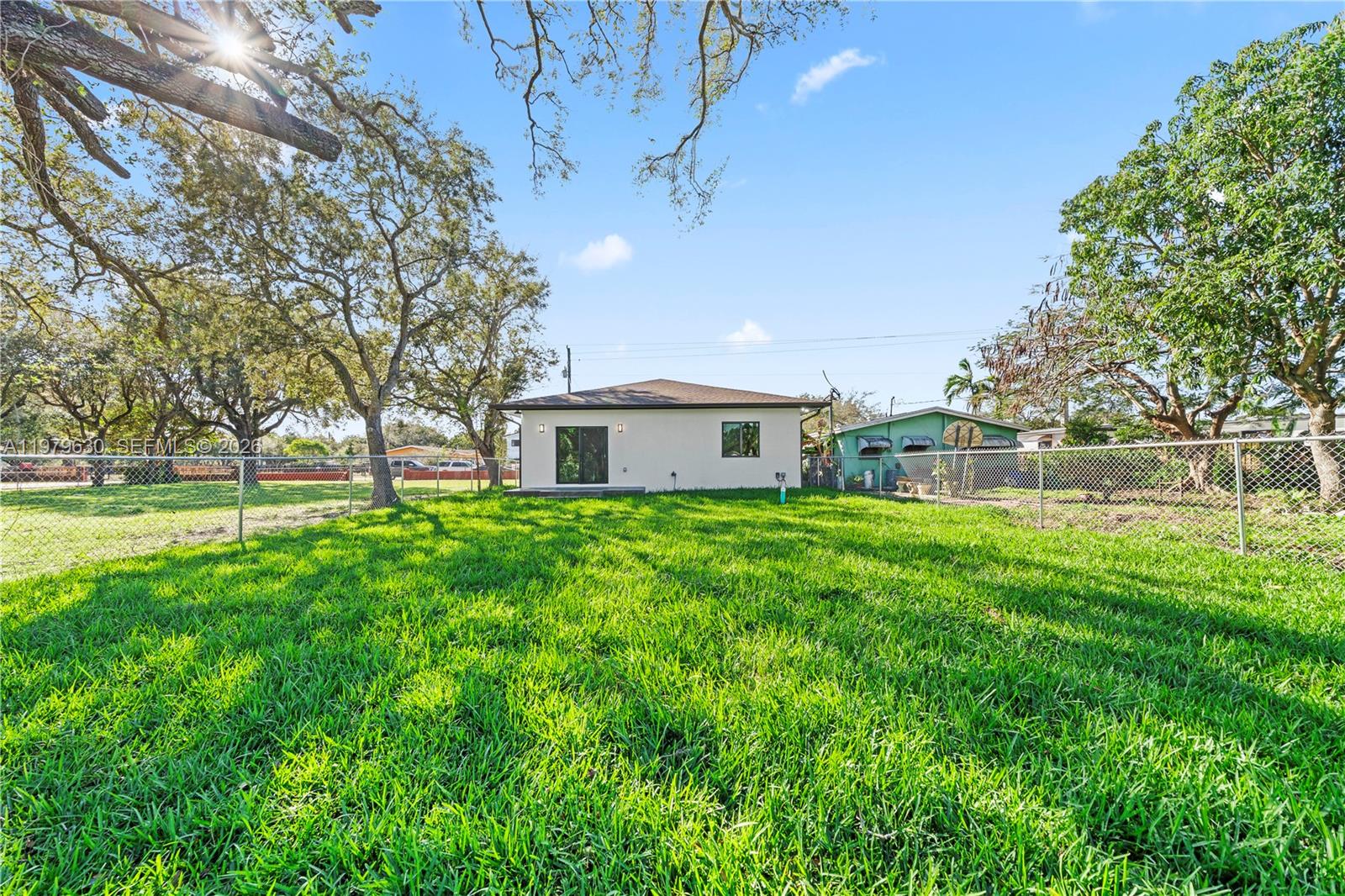 1735 Northwest 84th Street Miami, FL 33147 - Photo 21 of 26 a front view of a house with garden