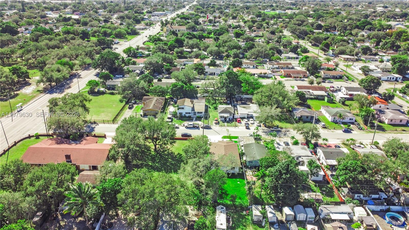 1735 Northwest 84th Street Miami, FL 33147 - Photo 24 of 26 an aerial view of residential houses with outdoor space and trees