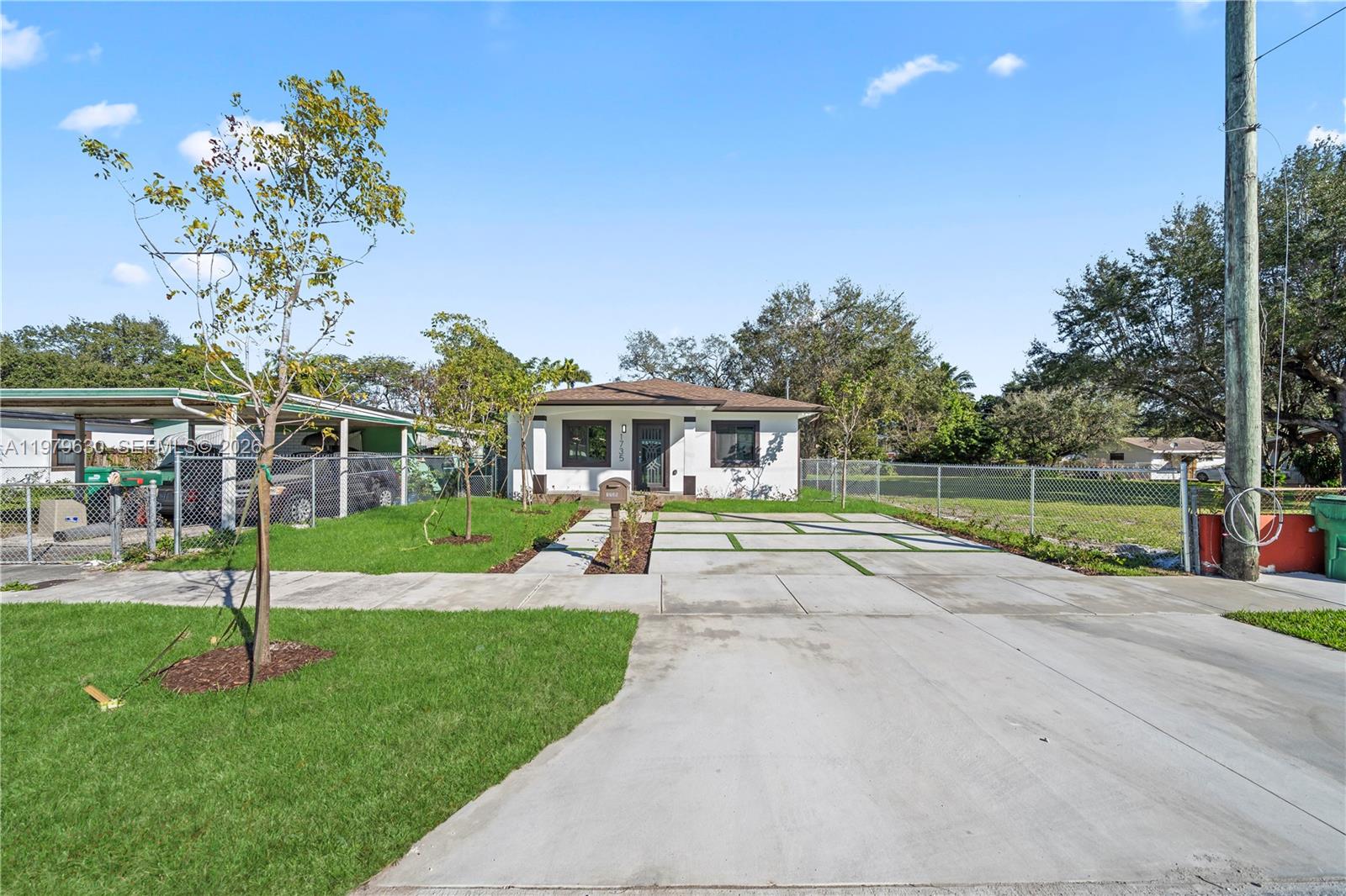 1735 Northwest 84th Street Miami, FL 33147 - Photo 3 of 26 a view of a house with a backyard porch and sitting area
