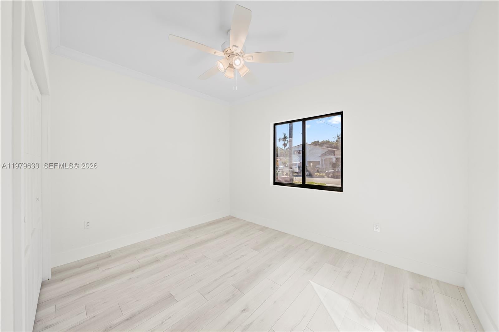 1735 Northwest 84th Street Miami, FL 33147 - Photo 10 of 26 a view of an empty room with a window