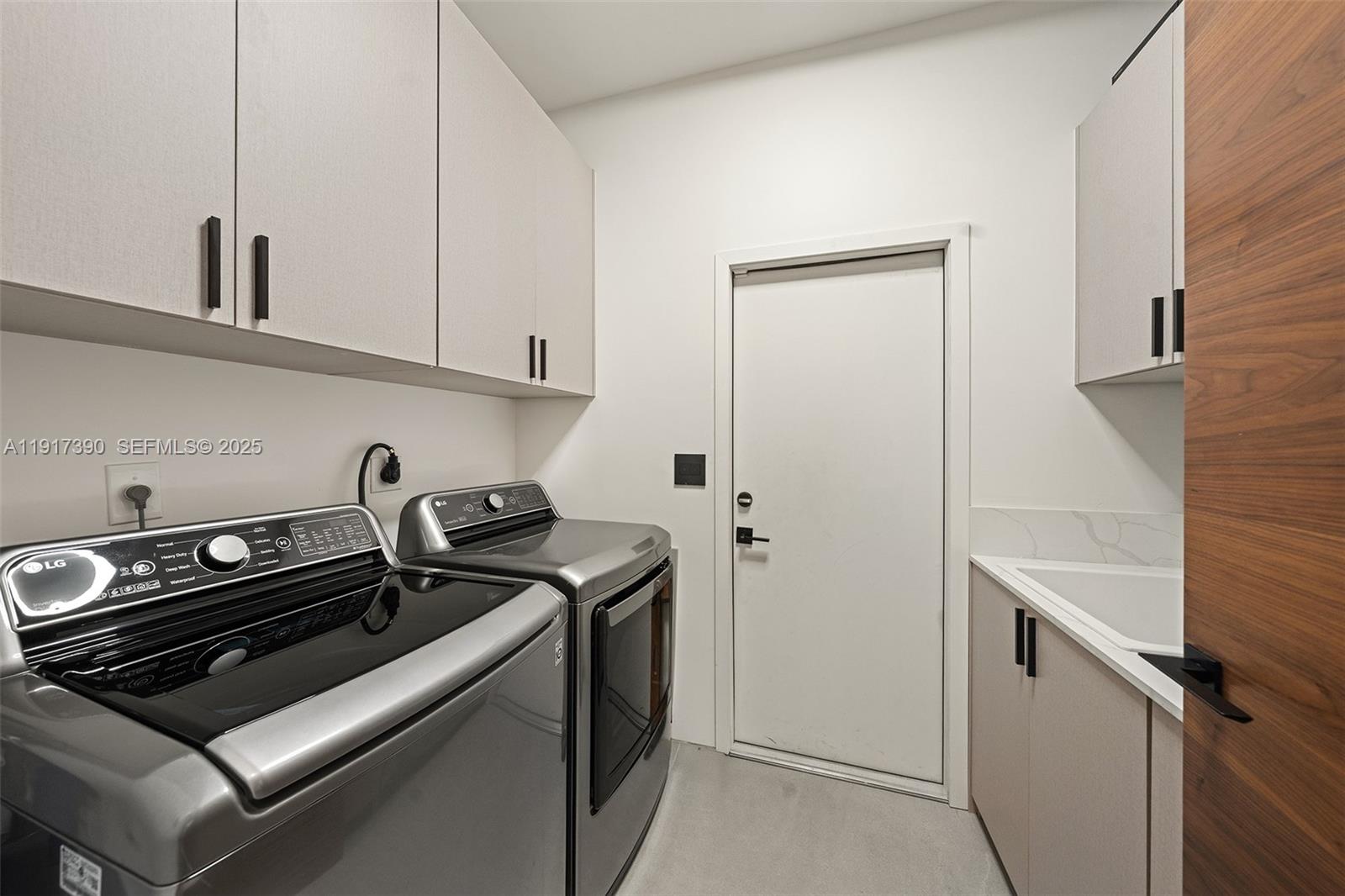 900 Washington Street Hollywood, FL 33019 - Photo 34 of 61 a kitchen with a stove and white cabinets
