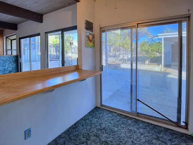 a view of a room with a hallway