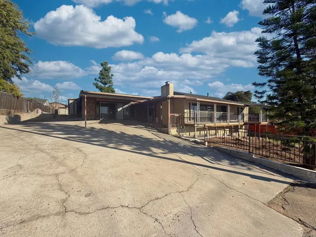 a view of a house with roof deck