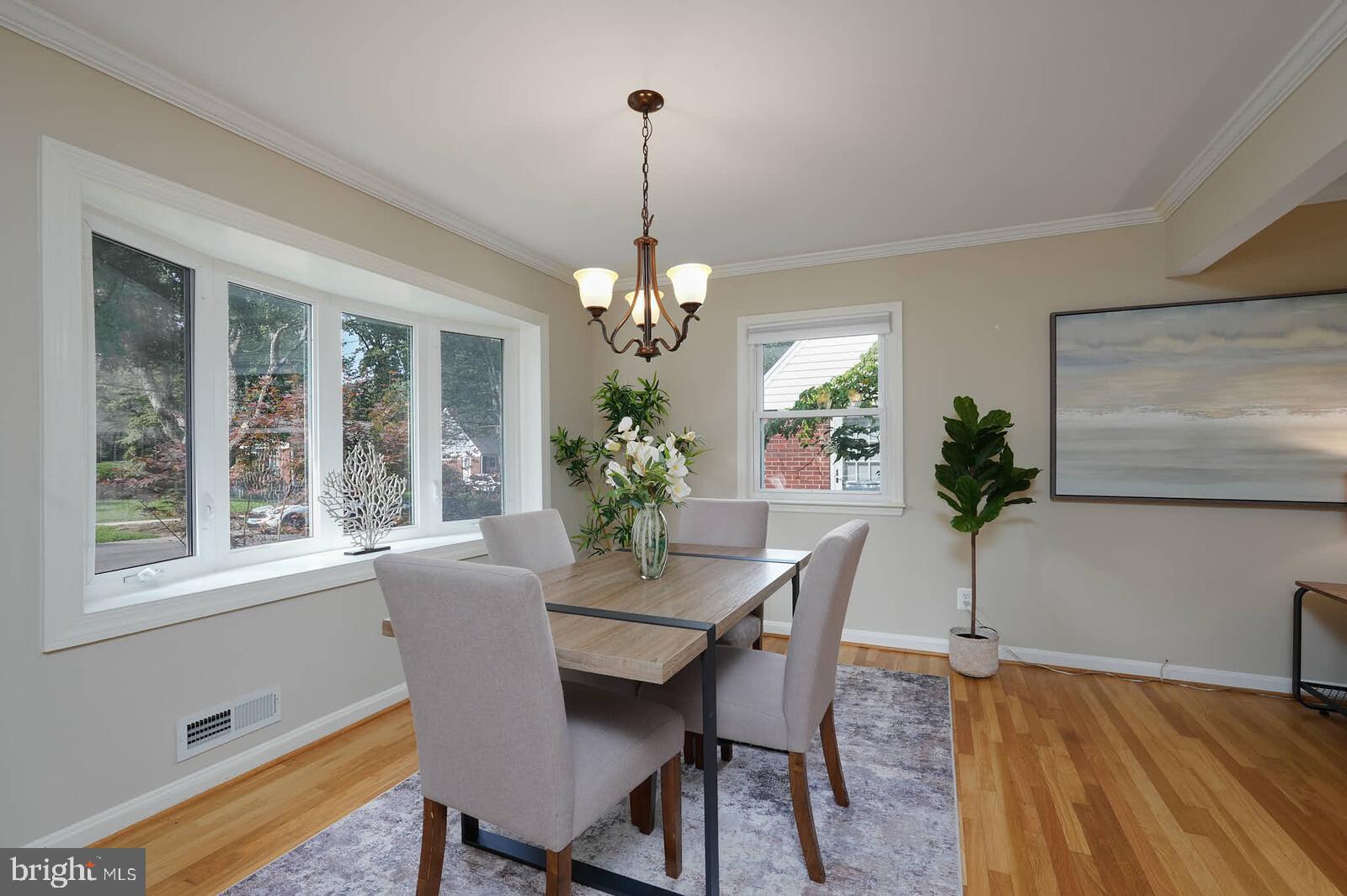 Dining room brightened by bay window