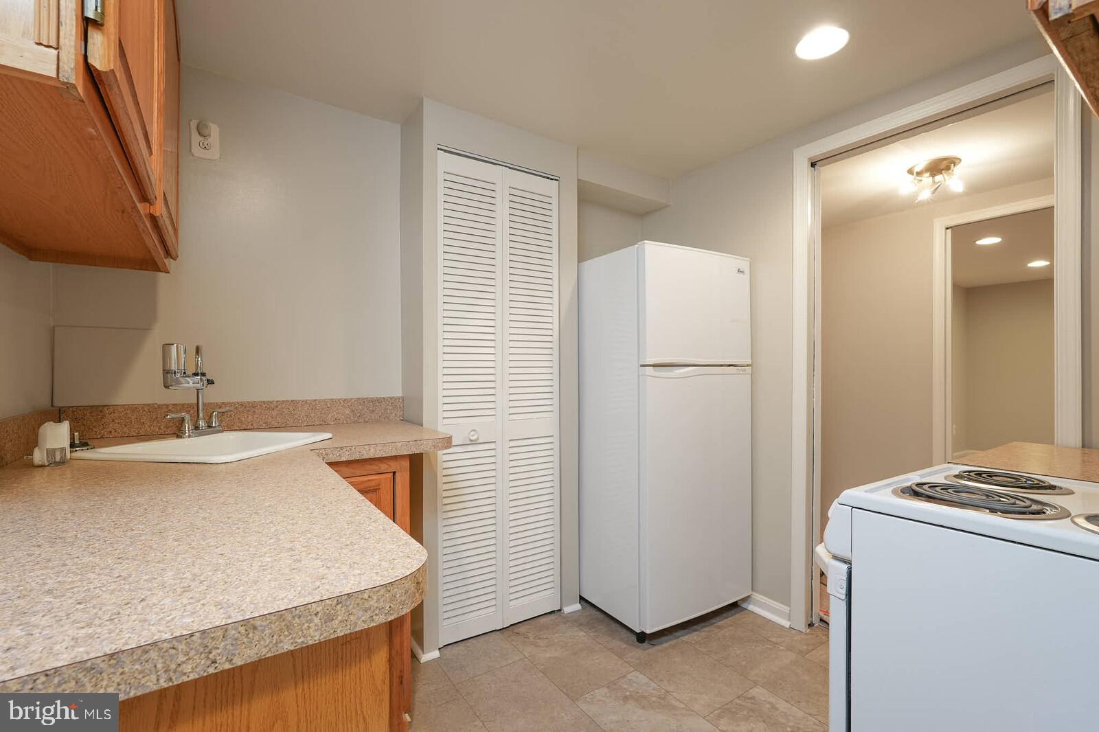 3909 Adams Drive Silver Spring, MD 20902 - Photo 32 of 49 Kitchenette in lower level with new LVT flooring