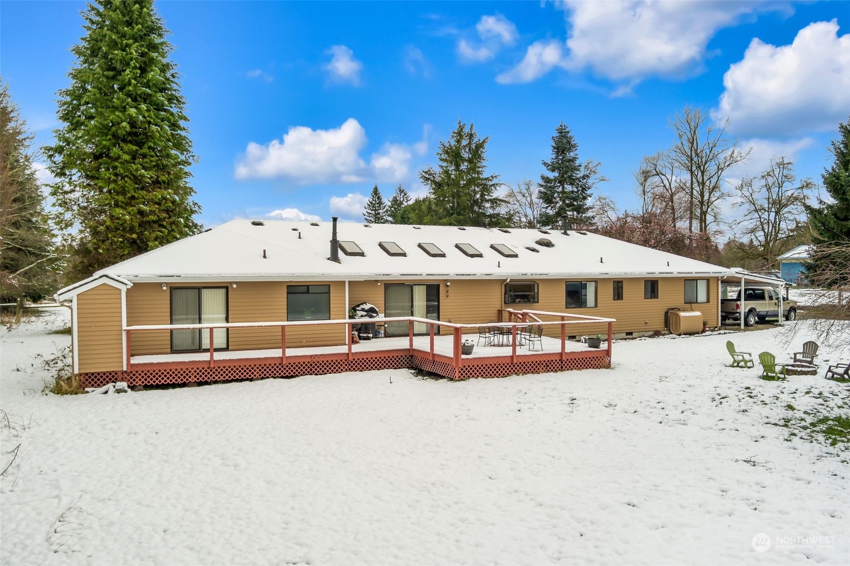 20615 Brown Road Monroe, WA 98272 - Photo 2 of 36 a view of a white house with a yard covered with snow in front of it