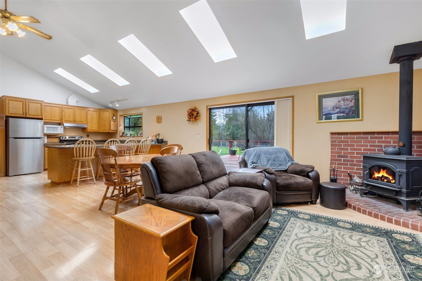 20615 Brown Road Monroe, WA 98272 - Photo 25 of 36 a living room with furniture a fireplace and a flat screen tv