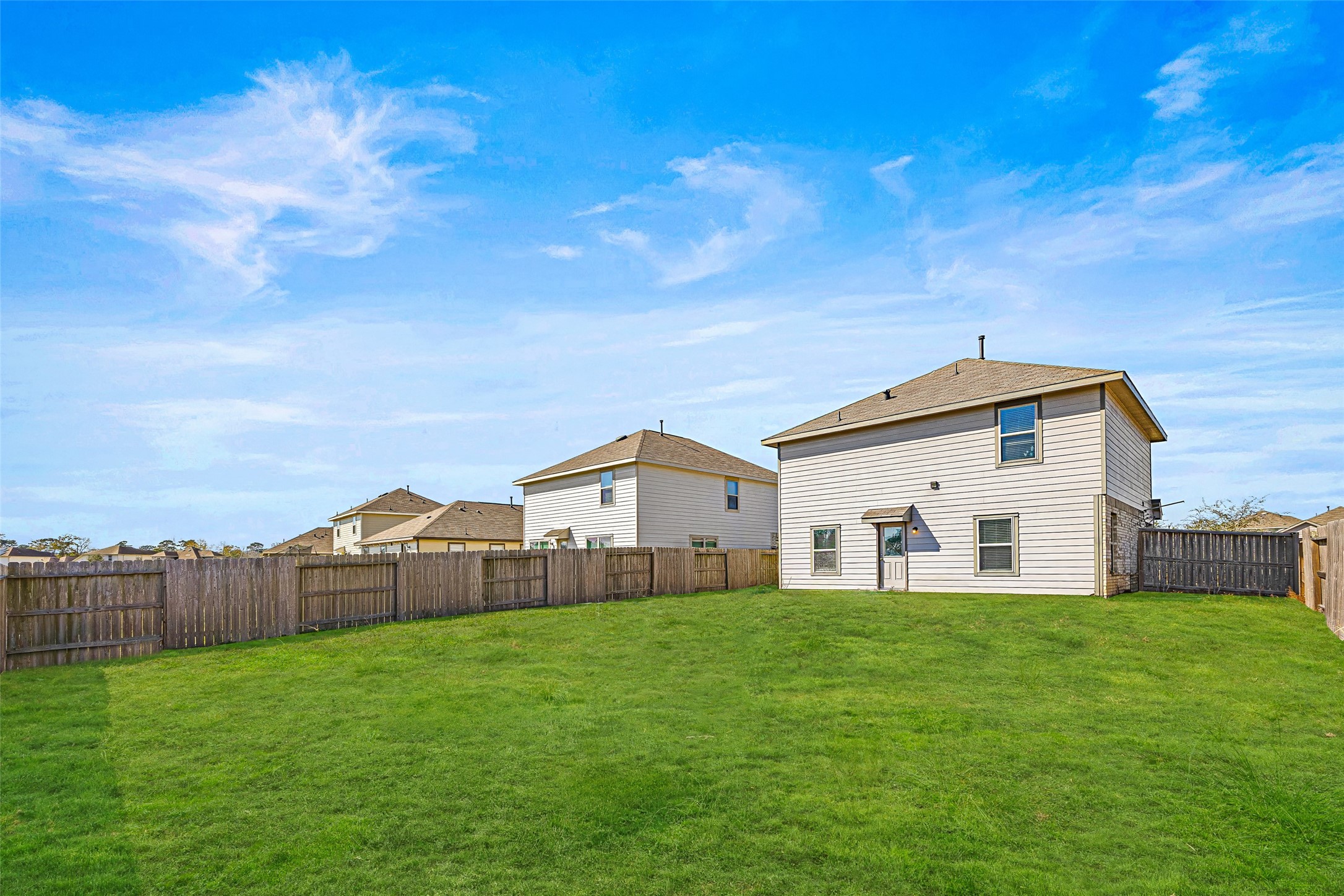 5976 Rimini Landing Lane Porter, TX 77365 - Photo 17 of 18 a view of a house with a big yard and large trees