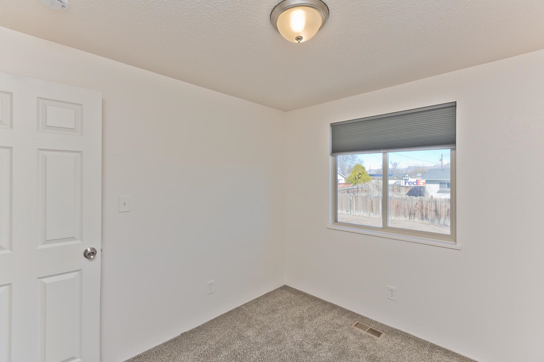 3212 D D 1/4 Road Clifton, CO 81520 - Photo 10 of 25 an empty room with windows
