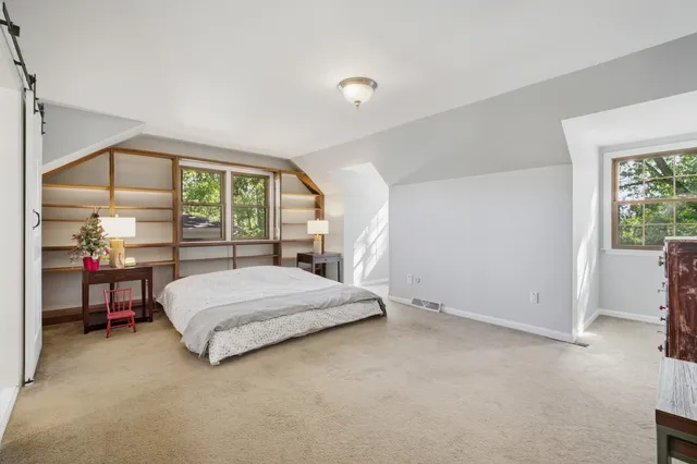 a bathroom with a tub shower vanity and sink