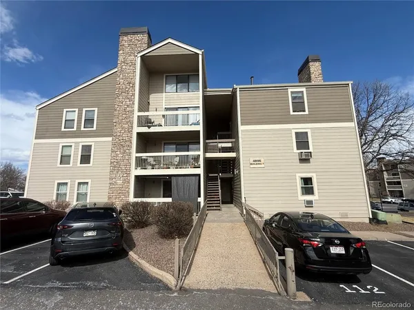 a front view of a house with parking space