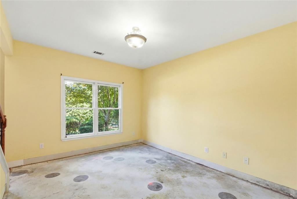 3420 Bulloch Lake Road Loganville, GA 30052 - Photo 9 of 57 an empty room with a empty space and a window