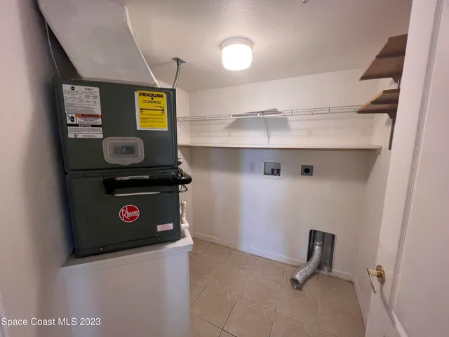 a view of kitchen stove with cabinets