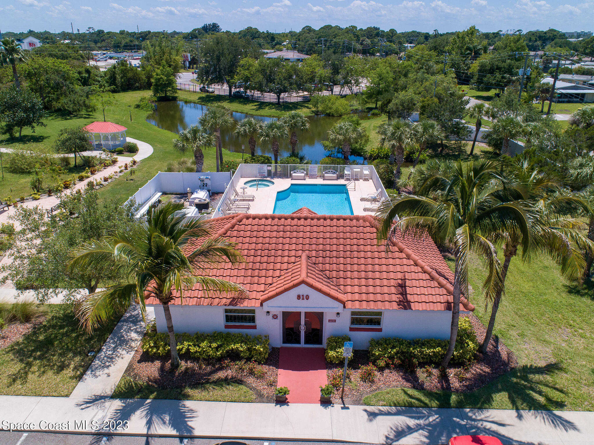 800 Del Rio Way, Unit 402 Merritt Island, FL 32953 - Photo 17 of 24 an aerial view of a house with a lake view