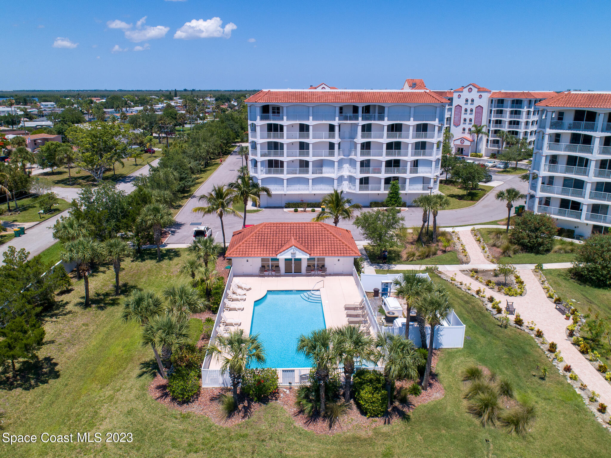 800 Del Rio Way, Unit 402 Merritt Island, FL 32953 - Photo 20 of 24 a aerial view of a building and front view of a building