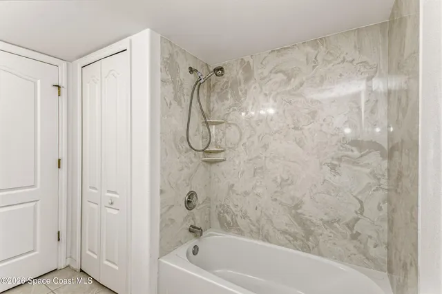 a view of a swimming pool with a yard