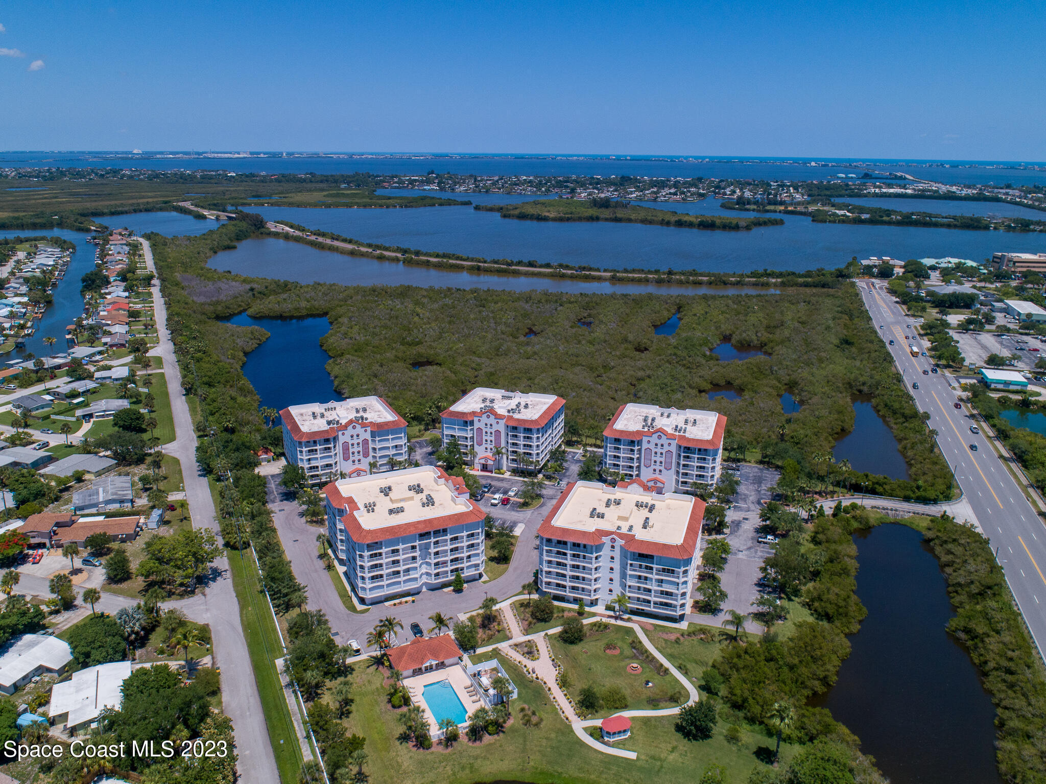 800 Del Rio Way, Unit 402 Merritt Island, FL 32953 - Photo 21 of 24 an aerial view of a house with swimming pool and ocean view