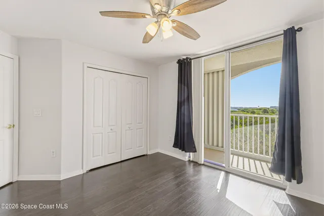 a front view of a building with a garden