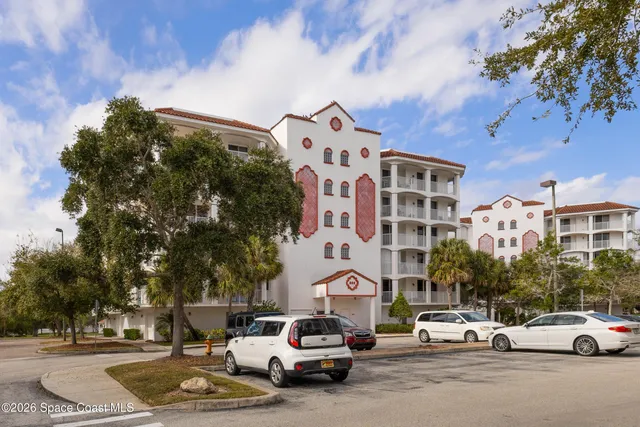 a view of a swimming pool and lounge chairs
