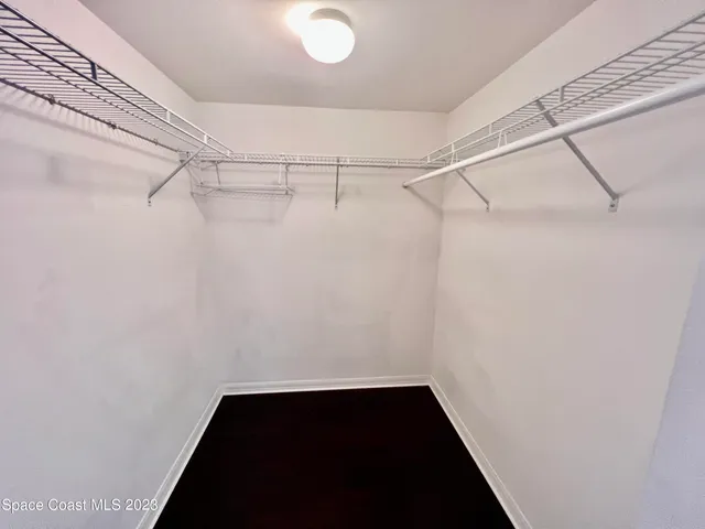 a view of a room with racks on the wall