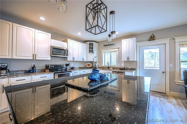 $645,000 | 401 Putt N Bay Drive, Sunrise Beach, MO 65079