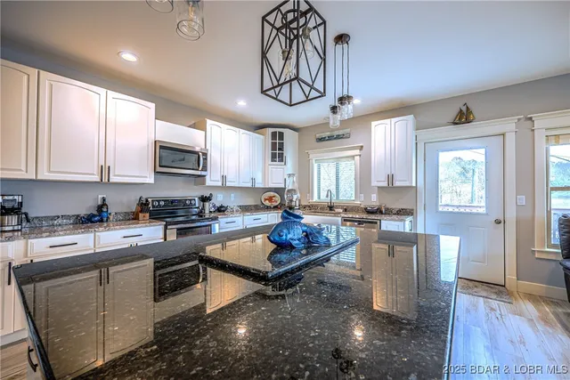 $645,000 | 401 Putt N Bay Drive, Sunrise Beach, MO 65079