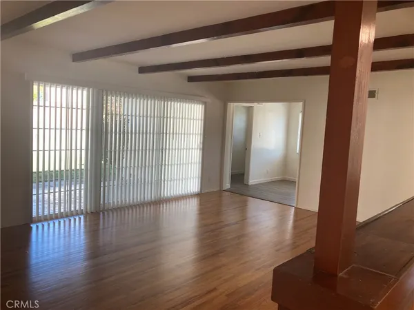 a view of a livingroom with wooden floor