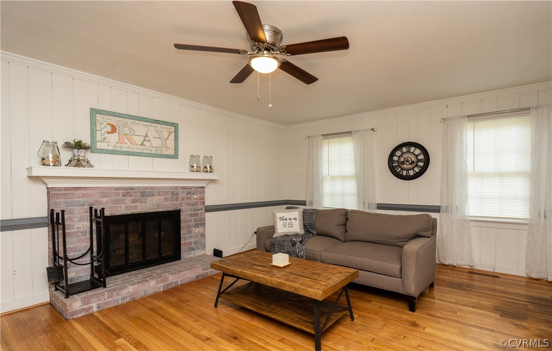11330 Poplar Ridge Road Chesterfield, VA 23236 - Photo 12 of 32 a living room with furniture a fireplace and a flat screen tv