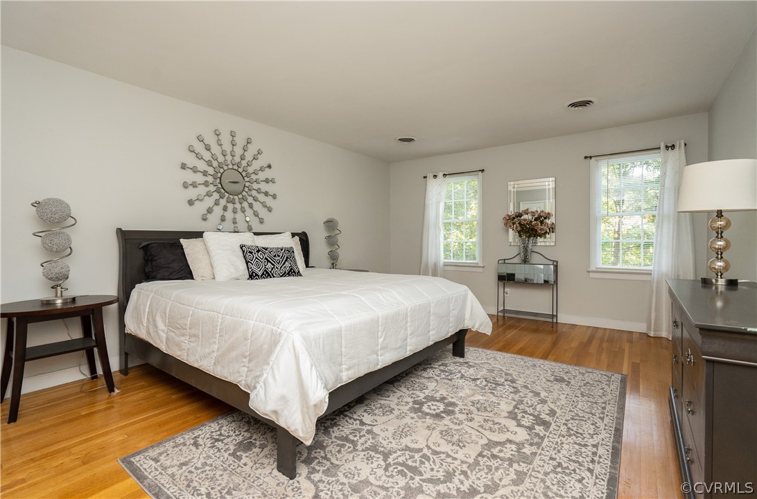 11330 Poplar Ridge Road Chesterfield, VA 23236 - Photo 18 of 32 a bedroom with a large bed and a dresser
