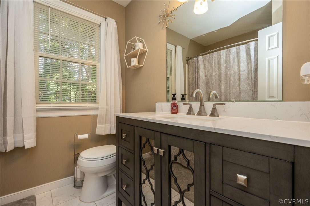11330 Poplar Ridge Road Chesterfield, VA 23236 - Photo 23 of 32 a bathroom with a sink and a toilet