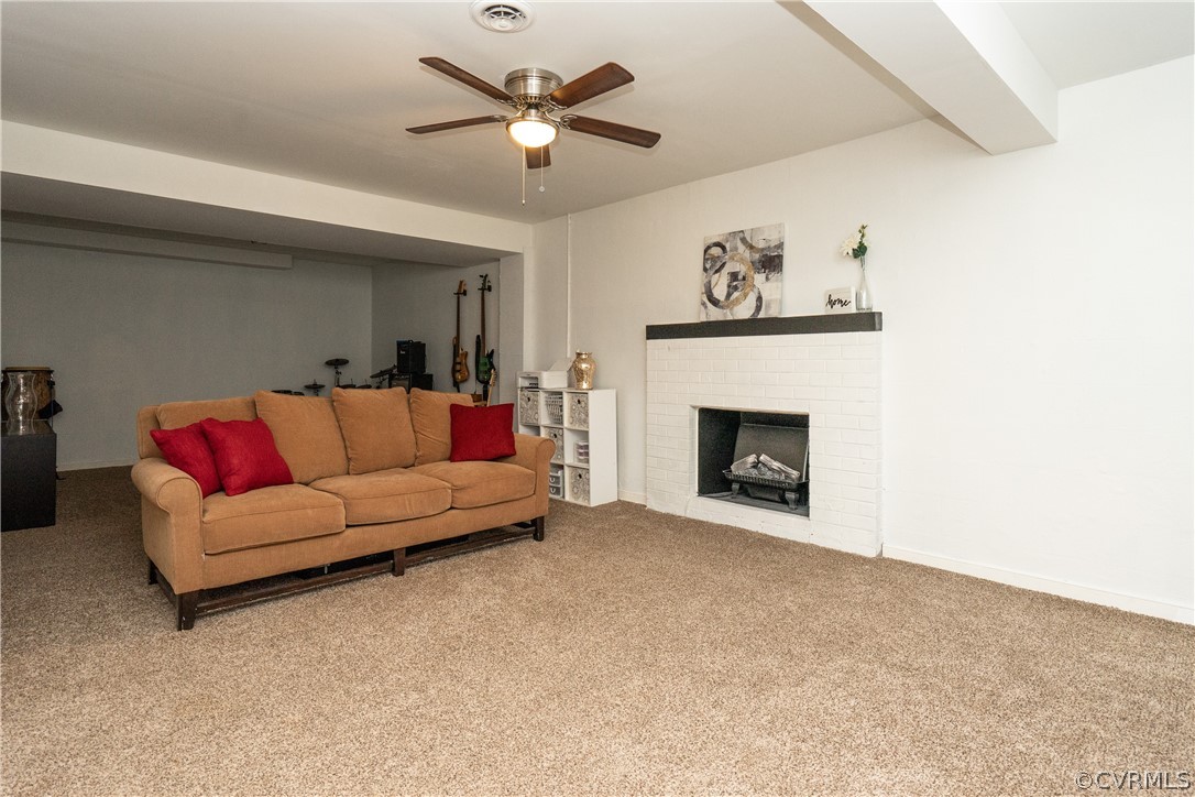 11330 Poplar Ridge Road Chesterfield, VA 23236 - Photo 27 of 32 a living room with furniture and a fireplace
