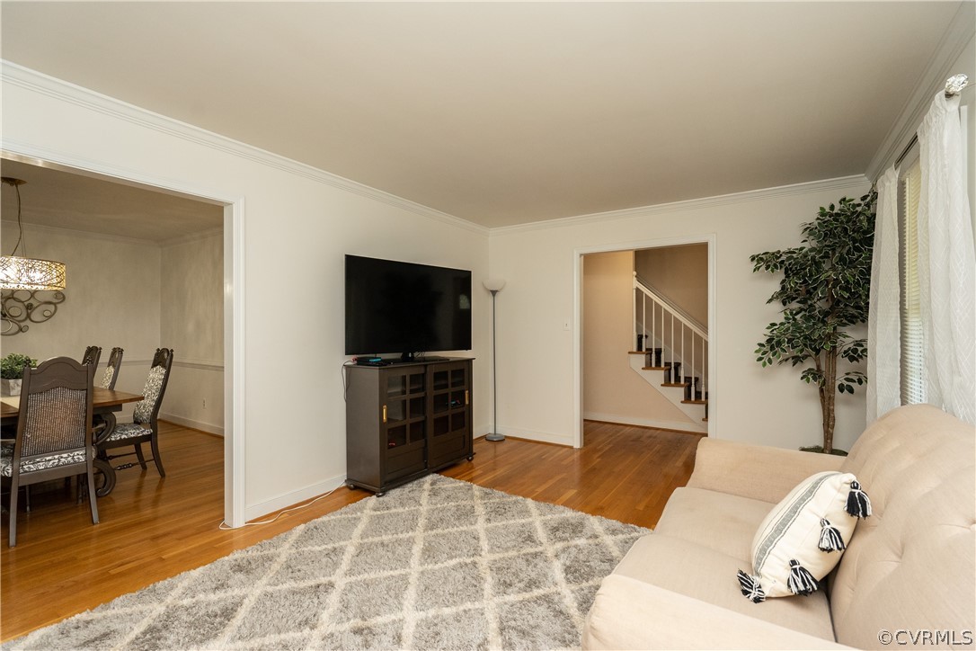 11330 Poplar Ridge Road Chesterfield, VA 23236 - Photo 6 of 32 a living room with furniture and a flat screen tv