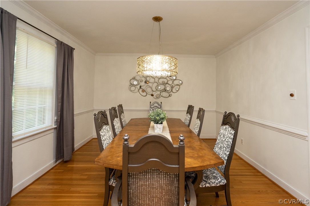 11330 Poplar Ridge Road Chesterfield, VA 23236 - Photo 7 of 32 a view of a dining room with furniture wooden floor and chandelier