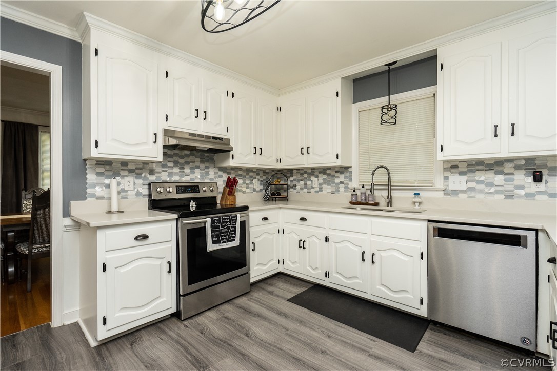 11330 Poplar Ridge Road Chesterfield, VA 23236 - Photo 9 of 32 a kitchen with stainless steel appliances granite countertop a sink a stove and cabinets