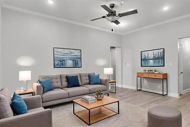 a living room with furniture a lamp and a painting on the wall