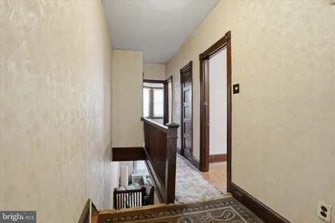 a view of a bathroom with mirror gate
