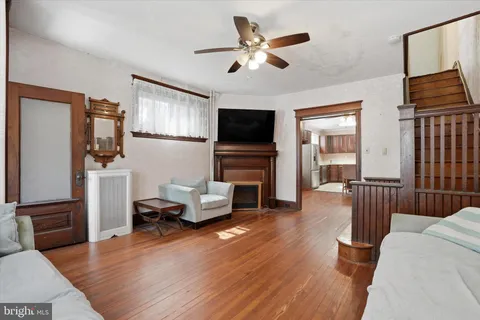 a living room with furniture flat screen tv and a fireplace