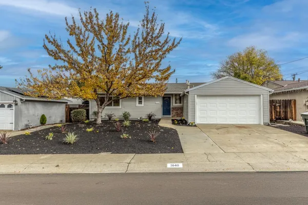 a front view of a house with yard