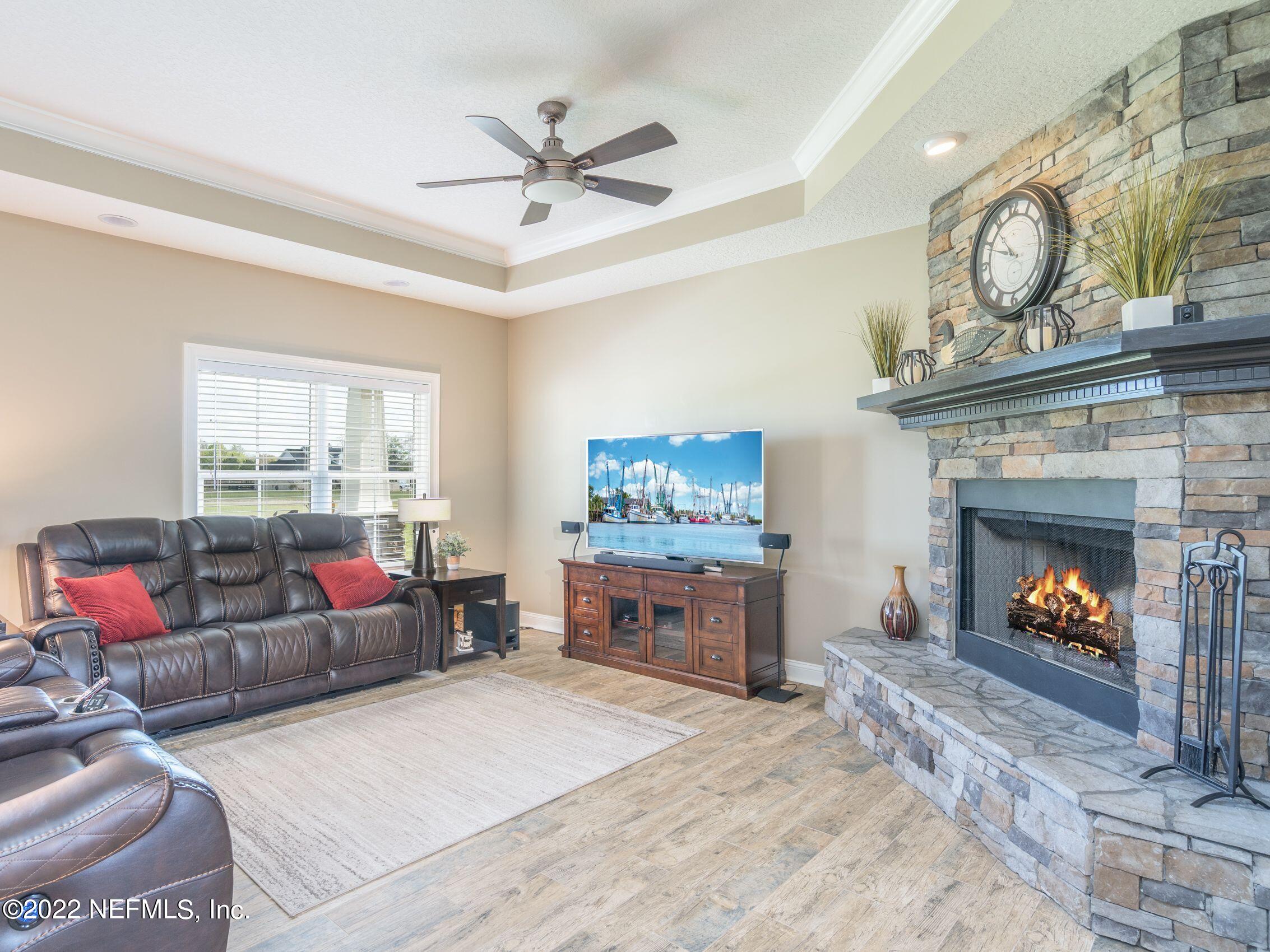 54476 Wildlife Way Callahan, FL 32011 - Photo 14 of 35 a living room with furniture a fireplace and a window