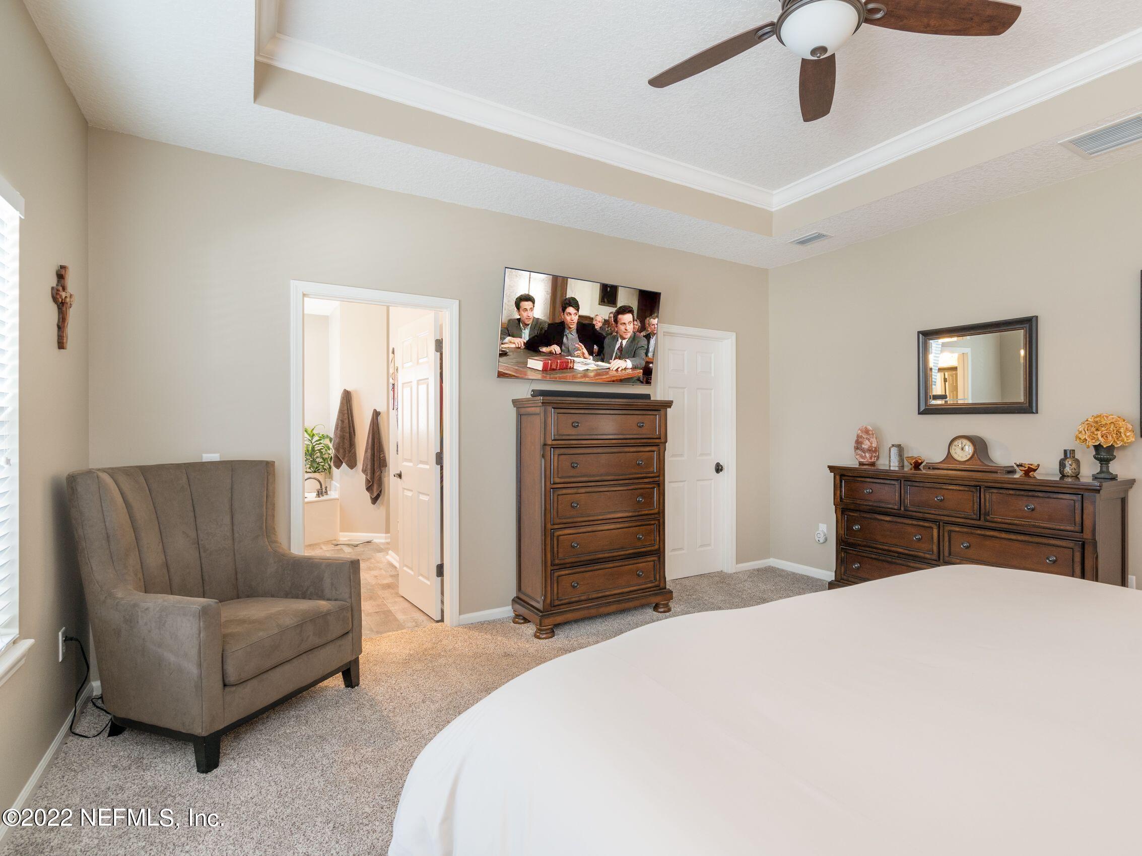 54476 Wildlife Way Callahan, FL 32011 - Photo 16 of 35 a bedroom with a bed and furniture