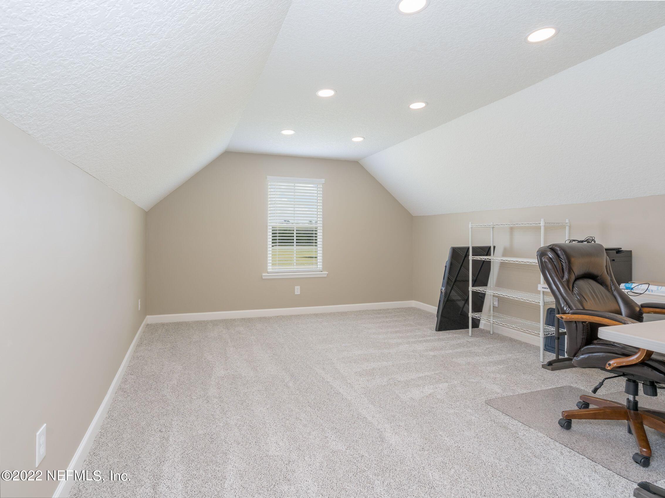 54476 Wildlife Way Callahan, FL 32011 - Photo 21 of 35 a view of a workspace with furniture and a window