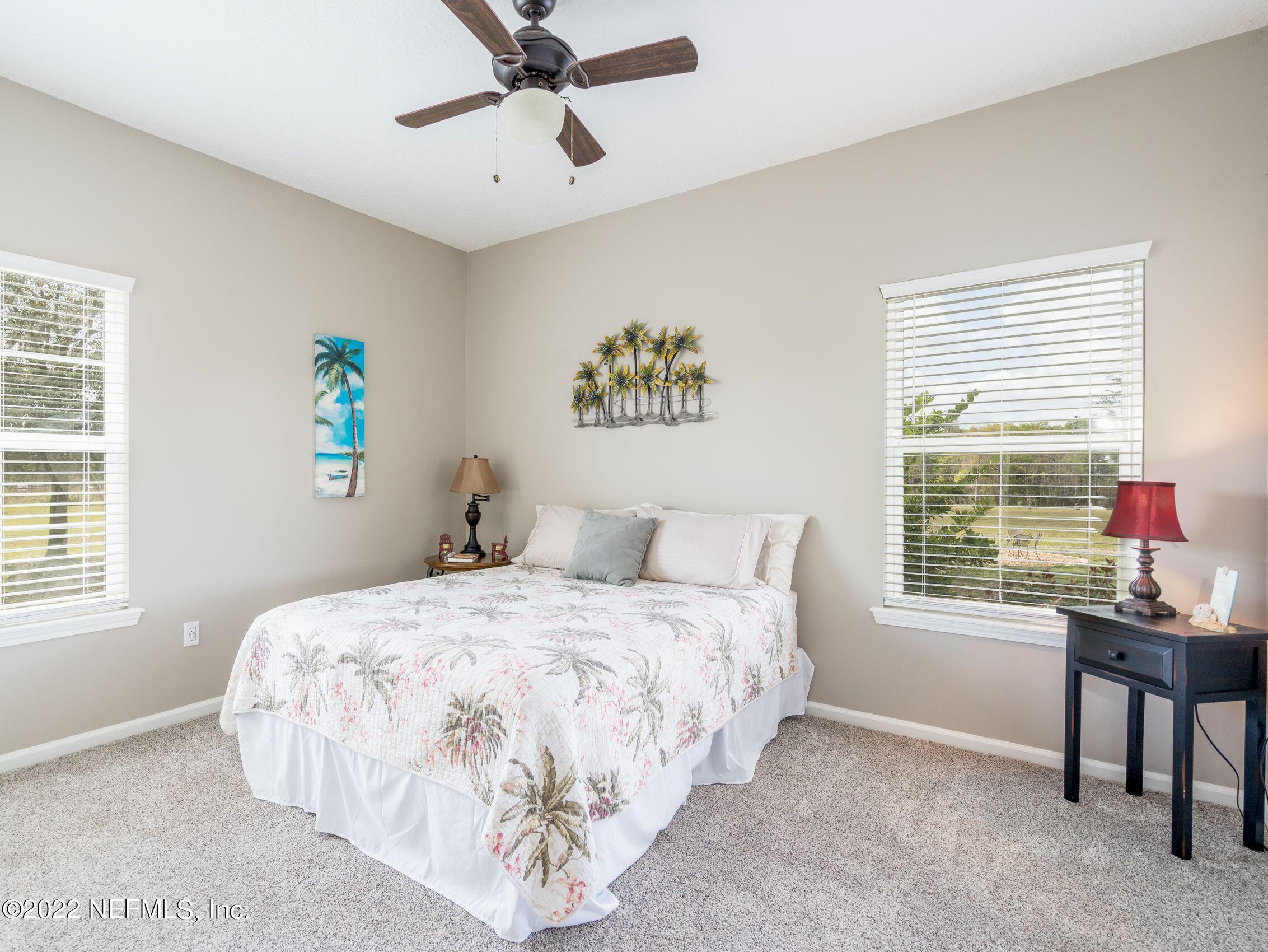 54476 Wildlife Way Callahan, FL 32011 - Photo 23 of 35 a bedroom with a bed and a window
