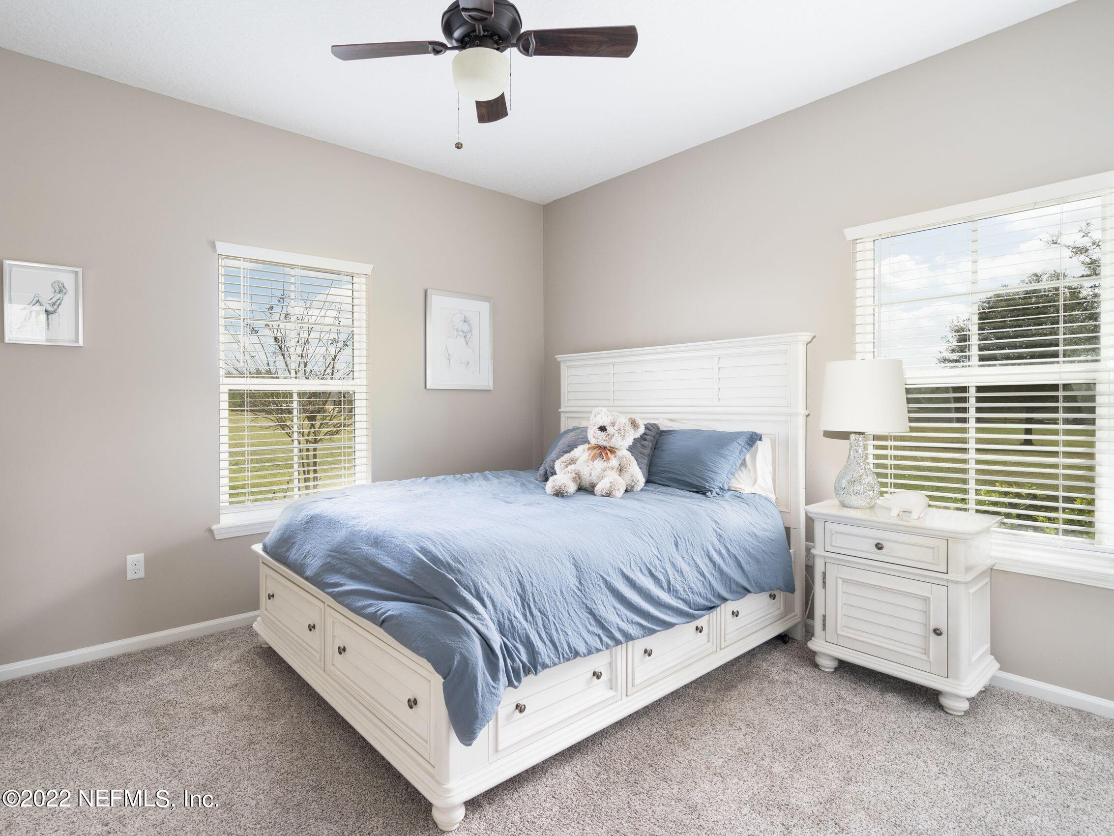 54476 Wildlife Way Callahan, FL 32011 - Photo 24 of 35 a bed sitting in a bedroom next to a window